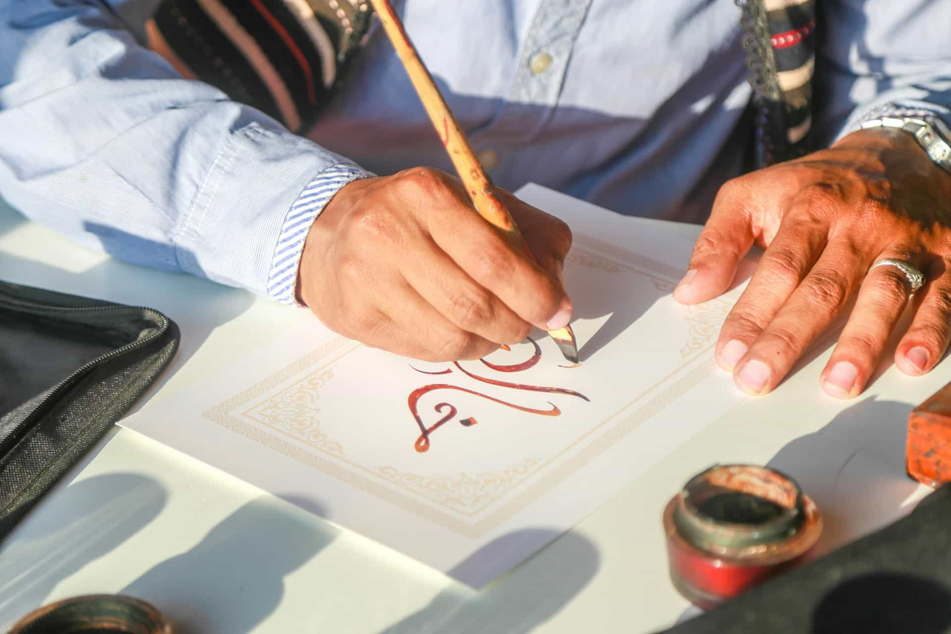 Person-writing-calligraphy-arabic-font.jpg